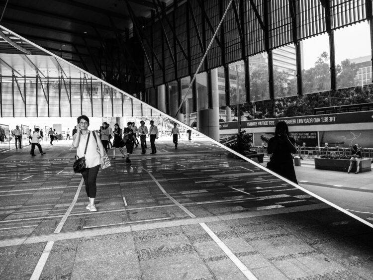 Two black and white photos, split along a diagonal line, of pedestrians at a transit sation.