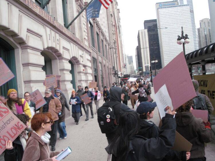 AIWU members and supporters protest outside of the SAIC Maclean building at AICWU’s informational picket on April 9, 2025. Photos by Gren Bee.
